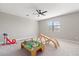 Bedroom featuring ample space for play with carpet flooring, ceiling fan and natural light at 15315 Golden Beam Pl, Bradenton, FL 34211