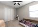 Neutral bedroom with large closet and bed featuring built-in shelving, illuminated by natural light at 15315 Golden Beam Pl, Bradenton, FL 34211