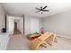 Spacious bedroom with carpet, ceiling fan, and a view into the hallway at 15315 Golden Beam Pl, Bradenton, FL 34211