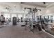 Well-equipped fitness center featuring a range of cardio machines, weight training equipment, and ample space at 15315 Golden Beam Pl, Bradenton, FL 34211