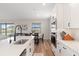 Bright kitchen featuring white cabinetry, quartz countertops, stainless steel appliances and an eat-in dining area at 15315 Golden Beam Pl, Bradenton, FL 34211