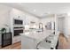 Modern kitchen features white cabinets, quartz countertops, stainless steel appliances, and a center island at 15315 Golden Beam Pl, Bradenton, FL 34211