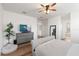 Spacious main bedroom with hardwood floors, a ceiling fan, and neutral décor at 15315 Golden Beam Pl, Bradenton, FL 34211