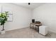 Minimalist home office space with desk, computer setup, neutral colors and carpeted floor at 15315 Golden Beam Pl, Bradenton, FL 34211