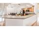 Open kitchen with wood cabinets, modern appliances, and view to breakfast nook at 1545 Deerbourne Dr, Wesley Chapel, FL 33543