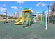 Colorful playground with slides, climbing structures, and cushioned ground for safe play at 1545 Deerbourne Dr, Wesley Chapel, FL 33543