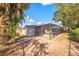 Expansive backyard featuring a screened pool enclosure, providing a private and serene outdoor space at 1811 Forest Dr, Oldsmar, FL 34677