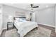 This bedroom features hardwood floors, neutral paint and carpet, a ceiling fan and plenty of natural light at 1811 Forest Dr, Oldsmar, FL 34677