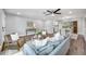 Comfortable living room with hardwood floors, soft lighting, and stylish accent furniture at 1811 Forest Dr, Oldsmar, FL 34677