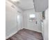 Practical mud room entrance featuring tile flooring, clean white walls, and a sturdy exterior door at 1811 Forest Dr, Oldsmar, FL 34677