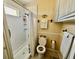 Bathroom with a shower, toilet, and cabinets at 205 Seagull N Dr, Tarpon Springs, FL 34689