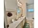 Bathroom features single sink vanity and a shower/tub combo at 205 Seagull N Dr, Tarpon Springs, FL 34689
