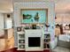 Living room fireplace featuring a decorative painting and built-in shelves at 205 Seagull N Dr, Tarpon Springs, FL 34689