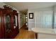 Hallway with a large china cabinet and gray walls at 205 Seagull N Dr, Tarpon Springs, FL 34689