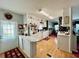 Bright kitchen with wooden floors, white cabinets, and modern appliances that create a cozy atmosphere at 205 Seagull N Dr, Tarpon Springs, FL 34689