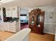 View from the kitchen into living area with display cabinet at 205 Seagull N Dr, Tarpon Springs, FL 34689