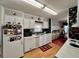Functional kitchen with white cabinets and appliances at 205 Seagull N Dr, Tarpon Springs, FL 34689