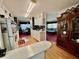 Open kitchen with wood floors offering seamless transition to dining area with a glimpse into living space at 205 Seagull N Dr, Tarpon Springs, FL 34689