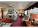 Bright living room featuring fireplace, open floorplan, and traditional decor at 205 Seagull N Dr, Tarpon Springs, FL 34689