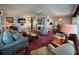 Spacious living room with brick fireplace, plush seating, and a warm, inviting atmosphere at 205 Seagull N Dr, Tarpon Springs, FL 34689