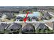 An aerial view highlights the home's position within a community with serene water features at 4375 Barletta Ct, Wesley Chapel, FL 33543