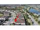 An aerial view showcases the home's location near a pond and within a well-planned community at 4375 Barletta Ct, Wesley Chapel, FL 33543