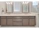 A bathroom featuring a double vanity and modern fixtures at 4375 Barletta Ct, Wesley Chapel, FL 33543