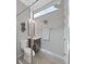 This is a compact bathroom featuring a glass-enclosed shower at 4375 Barletta Ct, Wesley Chapel, FL 33543