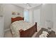 Cozy bedroom featuring natural light, a ceiling fan, and neutral decor at 4375 Barletta Ct, Wesley Chapel, FL 33543