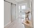 Stylish entryway featuring a decorative sliding barn door and elegant console table at 4375 Barletta Ct, Wesley Chapel, FL 33543
