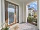 Inviting front porch features a decorative welcome mat and stylish double front door with sidelights at 4375 Barletta Ct, Wesley Chapel, FL 33543