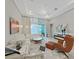 Living room with fireplace features lots of natural light, neutral decor, and an open floor plan at 4375 Barletta Ct, Wesley Chapel, FL 33543