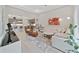 Living room adjacent to kitchen features an open floorplan, stylish decor, and hard surface floors at 4375 Barletta Ct, Wesley Chapel, FL 33543