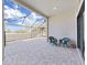 Outdoor patio with brick pavers under a screened enclosure, furnished with a table and chairs at 4375 Barletta Ct, Wesley Chapel, FL 33543