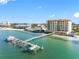 Aerial view of a waterfront condo with a private dock and stunning views of the surrounding bay at 6025 Sun Blvd # 302, St Petersburg, FL 33715