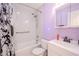 Updated bathroom with white subway tile, a shower/tub combo and a matching vanity at 6961 Dalkeith N Ave, St Petersburg, FL 33709