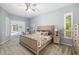 Serene main bedroom featuring plush carpeting, neutral tones, and pool access at 7185 N Serenoa Dr, Sarasota, FL 34241