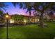 Charming exterior view of a single-story home with a well-manicured lawn and mature trees at 7185 N Serenoa Dr, Sarasota, FL 34241