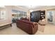 Open-concept living room with access to the lanai, complete with comfortable seating and natural light at 7185 N Serenoa Dr, Sarasota, FL 34241