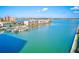 Aerial view showcasing waterfront condos and boat docks on a beautiful waterway at 7420 Bay Island S Dr # 281, South Pasadena, FL 33707