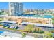 An aerial view shows the condo complex with stunning waterfront views, boat docks, and covered parking at 7420 Bay Island S Dr # 281, South Pasadena, FL 33707