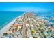 Stunning aerial view of a coastal community with beach access, clear blue waters, and charming residential streets at 7420 Bay Island S Dr # 281, South Pasadena, FL 33707