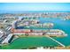 A vast aerial view of the waterfront community with a bridge, serene green waters, and luxury condos at 7420 Bay Island S Dr # 281, South Pasadena, FL 33707