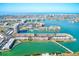 Sweeping aerial shot of a waterfront community with residences, marinas, and breathtaking bay and Gulf views at 7420 Bay Island S Dr # 281, South Pasadena, FL 33707