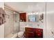 Updated bathroom featuring a glass-enclosed shower, vanity, and neutral tile work at 7420 Bay Island S Dr # 281, South Pasadena, FL 33707