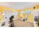 Bedroom boasts yellow walls, carpet flooring, large closet, and a sunny window at 7420 Bay Island S Dr # 281, South Pasadena, FL 33707