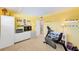 Bright bedroom featuring carpet floors, yellow walls, and a functional exercise area at 7420 Bay Island S Dr # 281, South Pasadena, FL 33707