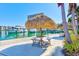 Picturesque dock featuring boats, tiki huts and waterfront views at 7420 Bay Island S Dr # 281, South Pasadena, FL 33707