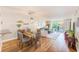 Bright living room with dining area and sliding doors leading to a balcony with a view at 7420 Bay Island S Dr # 281, South Pasadena, FL 33707