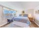 Serene bedroom with large window overlooking the water, providing natural light and scenic views at 7420 Bay Island S Dr # 281, South Pasadena, FL 33707